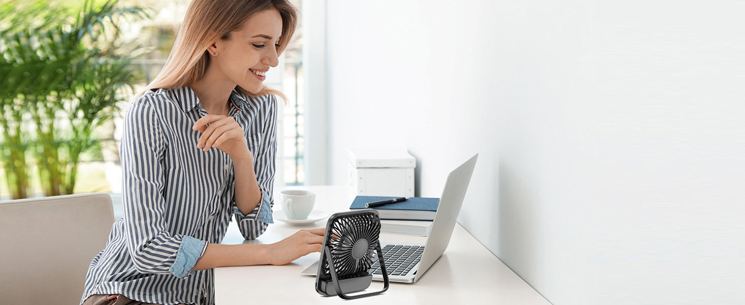 Warmco D2 portable desk fan — on a bedside table at night